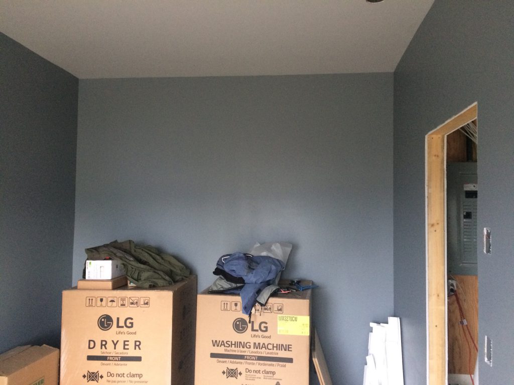 washer and dryer in bedroom